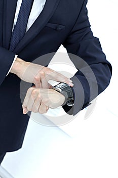 Close up. the businessman looks at his wristwatch.photo with copy space