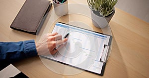 Close-up Of Businessman With Pen Working On Gantt Chart