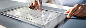 Businessman Checking Invoice On Digital Tablet