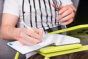 Close up of businessman's hand writing