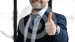 Close up of businessman show thumb up to good service