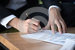 Close up businessman signing contract, partnership agreement, making deal