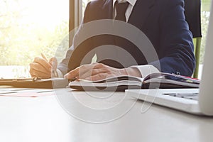 Close-up Of Businessman Signing Contract, writing paper at the d