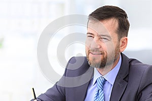 Close-up of businessman smiling.