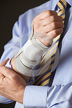 Close Up Of Businessman Suffering With Repetitive Strain Injury