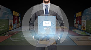 Close up of businessman in suit with email icon