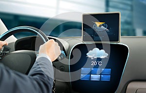 Close up of businessman with tablet pc driving car