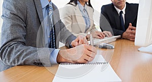 Close up of businessman taking notes