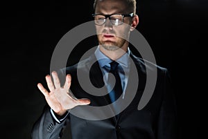 Close up of businessman touching virtual screen