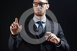 Close up of businessman touching virtual screen