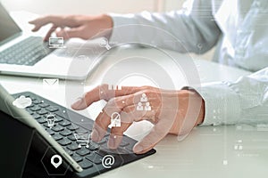 close up of businessman typing keyboard with laptop computer and