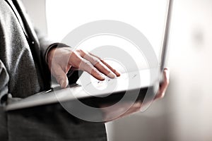 Close up.businessman typing on a laptop keyboard. on white background