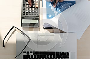 Close up businessman using calculator on documents Unrecognizable finance use calculate about cost at office