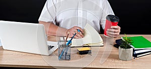 close up of businessman working at office with financial documents chart statistic with laptop