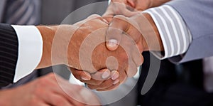 Close-up of businessmen closing a deal