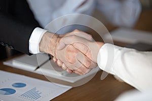 Businessmen handshake closing successful deal at meeting