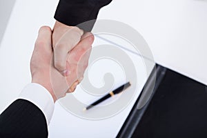 Close-up of a businessmen shaking hands