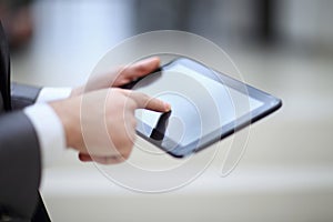 Close-up Of Businessperson Using Digital Tablet With Blank Display