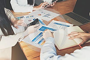 Close up of businesswoman or accountant hand holding pen working on calculator to calculate business data, accountancy document at photo