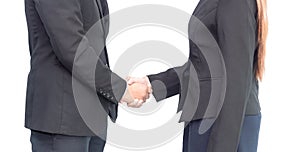 Close up of businesswoman and businessman shaking hands for agreement project during board meeting isolated on white background.