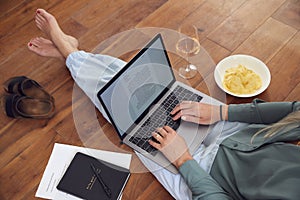 Close Up Of Businesswoman At End Of Day With Wine In Loungewear And Suit On Laptop Working At Home