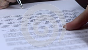 Close up of businesswoman hands signing contract on business office desk - fake signature