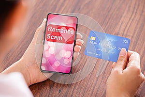 Woman Holding Credit Card And Mobile In Hands photo