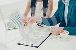Close up of businesswoman showing diagrama of financial growth to her partner photo