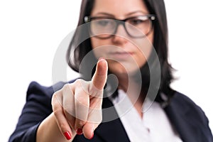 Close-up of businesswoman touching invisible screen with finger