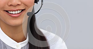 Close-up of a businesswoman using headset