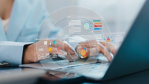 Businesswoman using laptop with data analytics dashboard and digital business report visualization