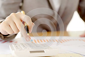 Close up of businesswomen accountant or banker making calculations. Sav