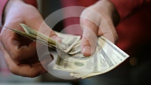 Close up of busness man hands counting money cash. Finance business success