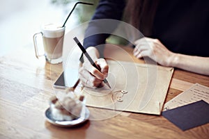 Close-up busyness concept. Stationary layouts. Wooden table in a cafe photo