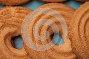 Close up of butter cookies/biscuits on wooden teal green rustic background photo