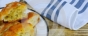 Close up of buttery garlic bread in banner shaped image.