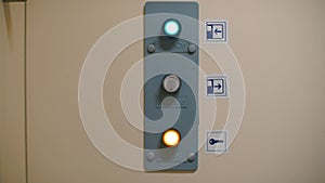 Close-up of buttons for automatically closing and opening doors.