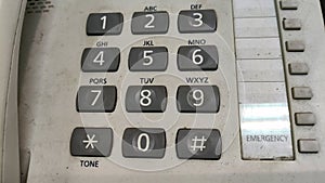 close up of buttons on a white telephone