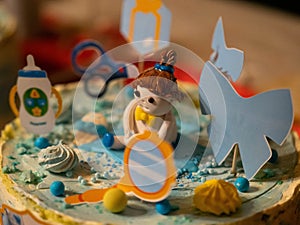 Close-up of cake figurines for a new born baby