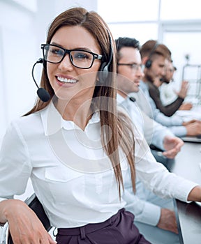 Close up. call center employee sitting at his Desk