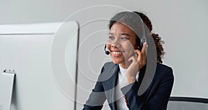 close up call center operator in wireless headset talking with customer, woman in headphones with microphone consulting