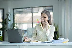 close up call center operator in wireless headset talking with customer, woman in headphones with microphone consulting