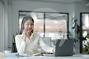 close up call center operator in wireless headset talking with customer, woman in headphones with microphone consulting