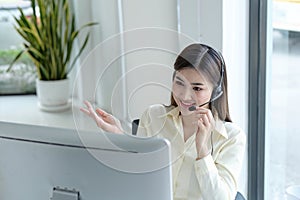 close up call center operator in wireless headset talking with customer, woman in headphones with microphone consulting