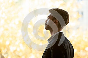 Close up of calm businessman meditating with eyes closed