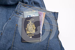 Close up canada passport and canadian dollar on blue jean with copy space