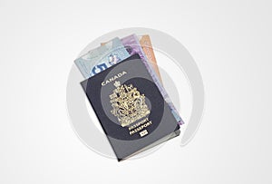 Close up canada passport and canadian dollar on white background, emigration banner with copy space
