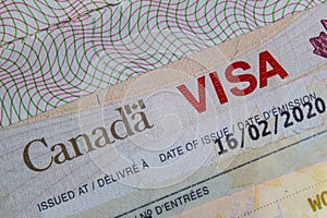 A Close up of a Canada VISA on a passport inside page