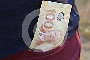 A close up of Canadian money- $100 bill
