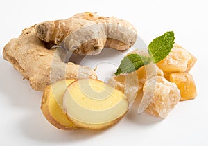 Close up of candied crystallized ginger candy pieces ,ginger and ginger slices isolated on white background